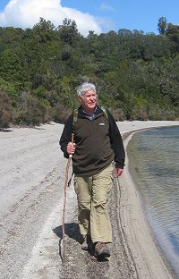 Alan Simmons walking on lakeshore